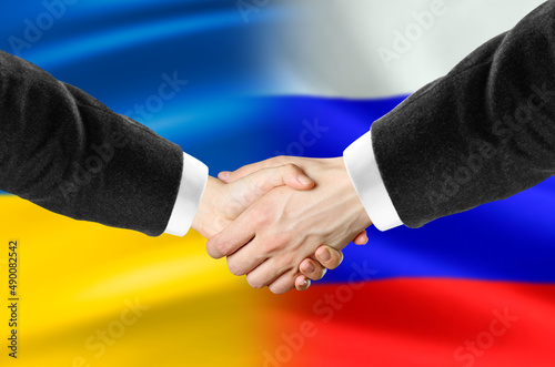 Handshake of Russia and Ukraine. The end of the war. Close up