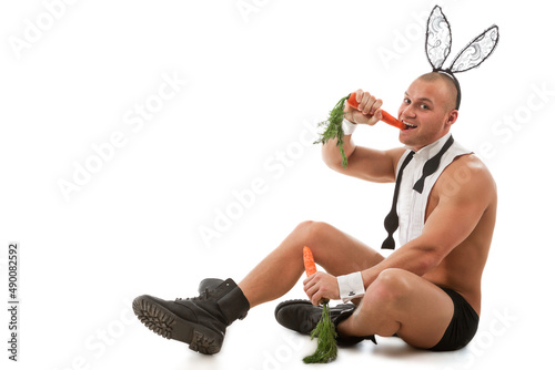 Canvas Print Lovely man in rabbit costume with carrots