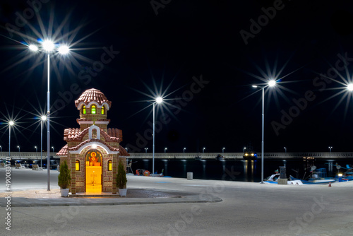 Coastal small church, the chapel on the pier, on the seashore, night view, Bulgaria