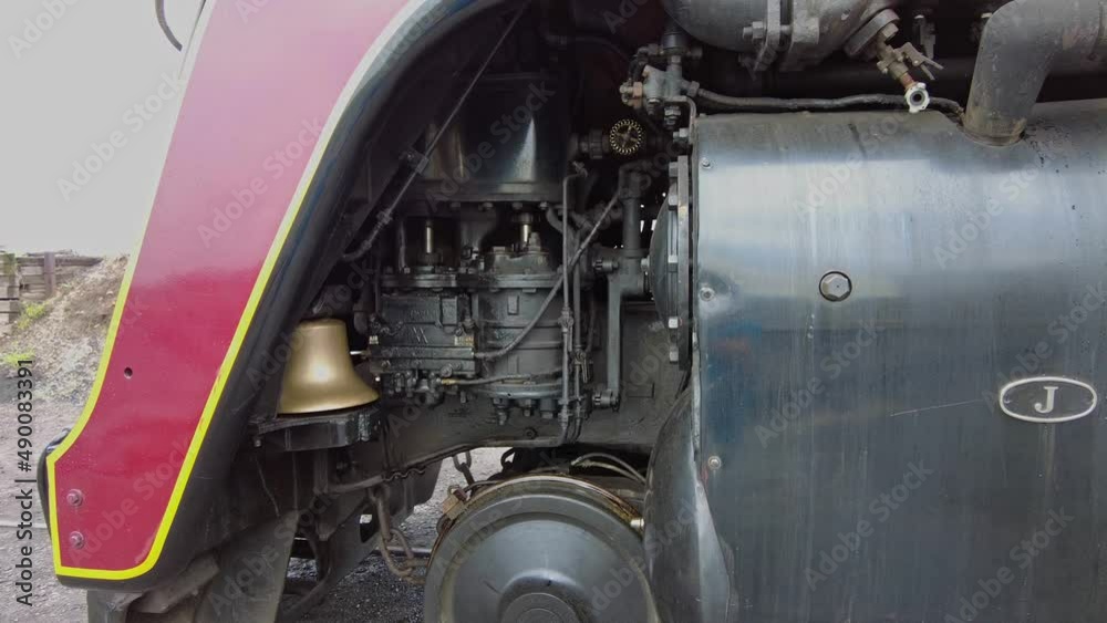 A Close Up Look at the Compressor and Valves of an Antique Steam Locomotive as it Gets Ready for a Day Work A Close Up Look at the Compressor and Valves of an Antique Steam Locomotive as it Gets Ready for a Day Work