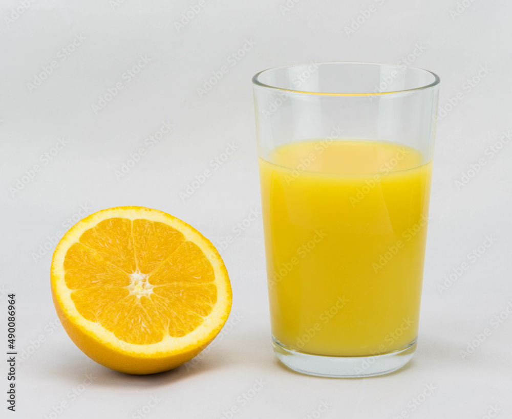 orang and a glass of orange juice orang and a glass of orange juice
