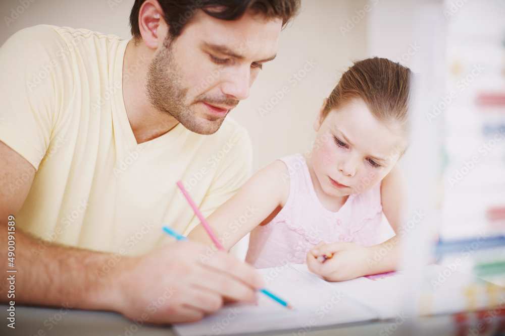 She always does her homework. Cropped shot of a little girl doing her homework. She always does her homework. Cropped shot of a little girl doing her homework.