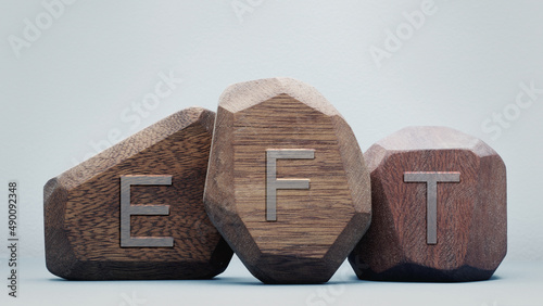 Letters EFT written on wooden blocks. Emotion-focused therapy and Emotional Freedom Technique treatment concept. photo