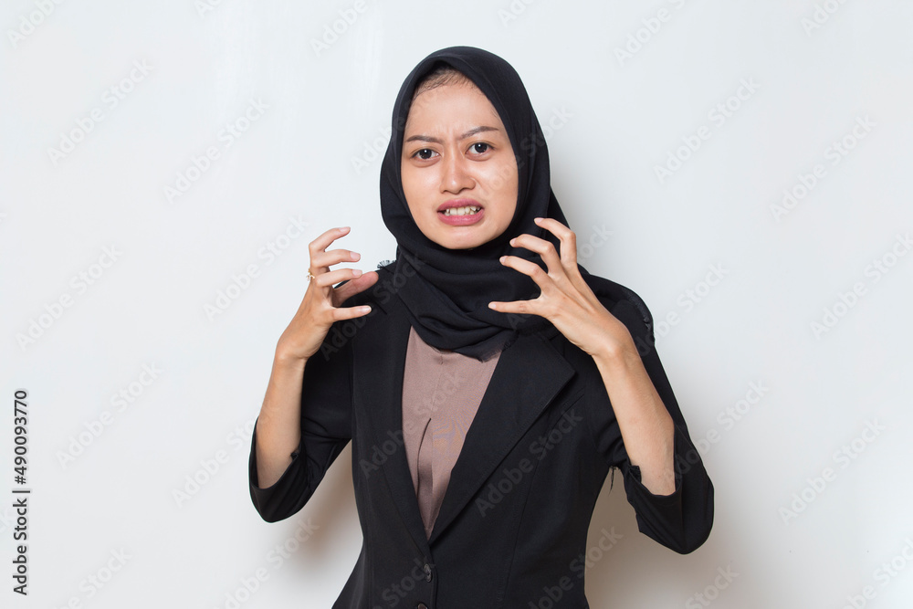 Angry emotional muslim woman in hijab shouting
Angry emotional muslim woman in hijab shouting