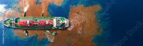 Oil leak from Ship , Oil spill pollution polluted water surface. water pollution as a result of human activities. industrial chemical contamination, webinar banner © Yellow Boat