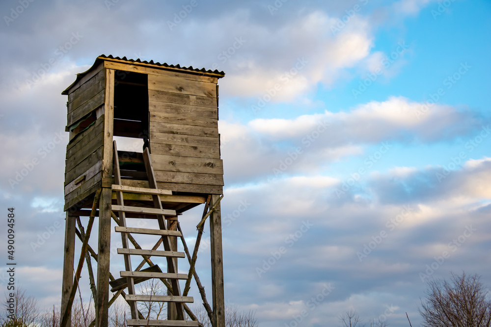 wooden hunter's pulpit against the sky wooden hunter's pulpit against the sky