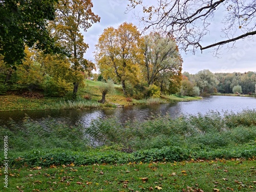 Calm on the surface of Lake Birini with colorful reflections on sunny autumn day photo