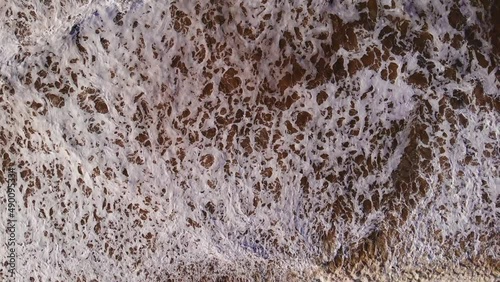 Aerial Birds Eye View Over Rough Sea Waves Breaking At Katwijk aan Zee. Slow Motion photo