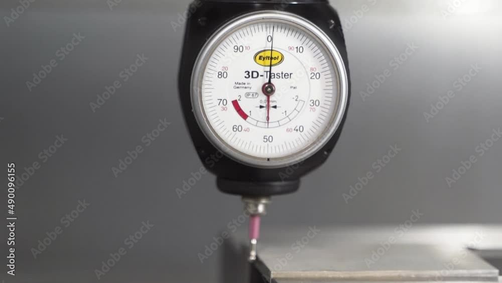 3D Taster dial indicator measuring, zeroing out dimensions, close up.