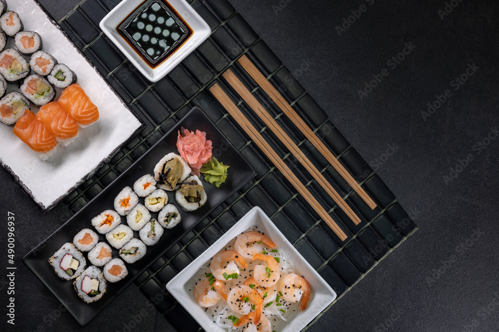 Various dishes of Asian cuisine with typical sushi Various dishes of Asian cuisine with typical sushi