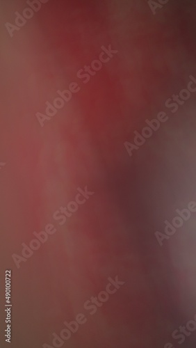 Abstract blur background with gray-brown, black, white, red and earth tones.