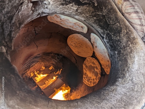 photo of arabic bread bakery with clay oven photo