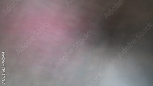 Abstract blur background with brown gray, black, white and earth tones.