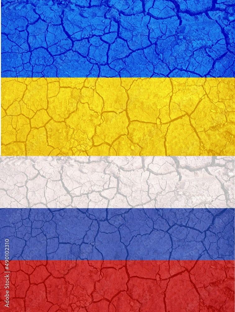 Ukraine and Russia two flags on flagpoles banner on cracked earth background vertical