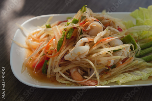 Papaya salad and seafood on dish and vegetables, Thai food for diet, Popular among consumers who want to refrain from starch and sugar. or those who are controlling weight.