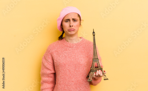 Sticker young pretty woman feeling sad and whiney with an unhappy look and crying