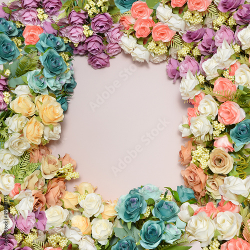 spring flowers, different colors roses on a pale pink background, free space for text, elegant spring composition, flower frame © Ritk