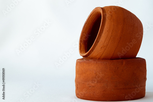 Two pieces of clay on a white background and a copy space. A set of pottery and copy space. photo