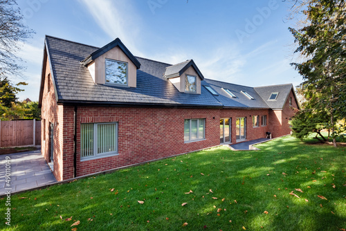 Modern home in dappled sunlight