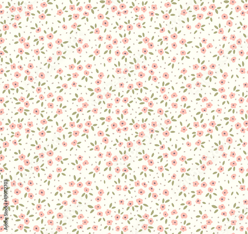 Vintage floral background. Floral pattern with small pastel pink flowers on a white background. Seamless pattern for design and fashion prints. Ditsy style. Stock vector illustration.