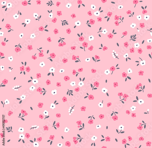 Vector seamless pattern. Pretty pattern in small flowers. Small white and pink flowers. Light pink background. Ditsy floral background. The elegant the template for fashion prints. Stock vector.