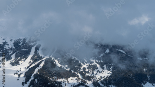 The image of the ski slopes covered by snow clouds. © PhotoBetulo