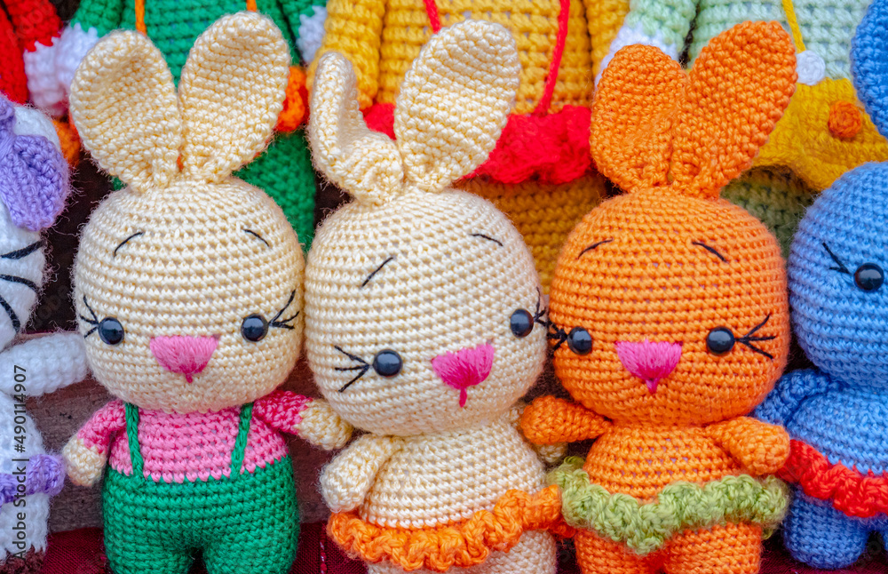 Fototapeta premium various colorfull knitted woven toys in the form of an animals