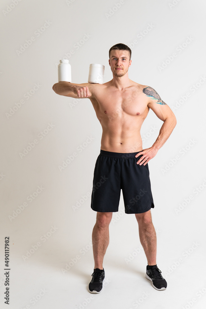 Fitness protein jars white on white background bodybuilder powder strong high ache body backache sick male medicine, muscular chronic. Touching lumbar problem suffer attractive Fitness protein jars white on white background bodybuilder powder strong high ache body backache sick male medicine, muscular chronic. Touching lumbar problem suffer attractive