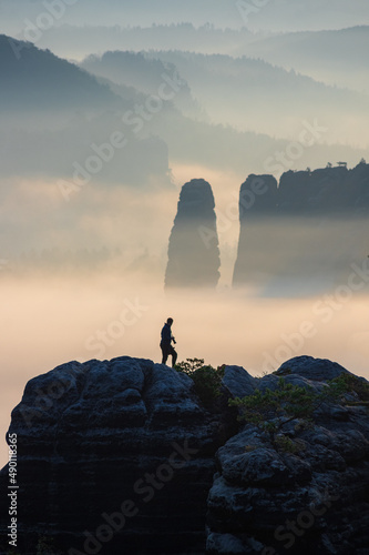 silhouette of a man on a rock