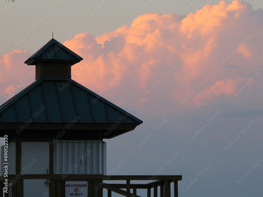 Lifeguard stand tower at the beach with beautiful background of sky and clouds