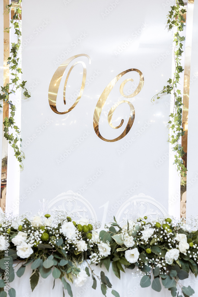Fototapeta premium Beautiful wedding arch of flowers for the newlyweds. Decoration on a holiday