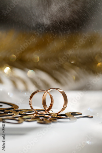 gold wedding rings on the wedding day for the newlyweds. Jewelry from expensive metal