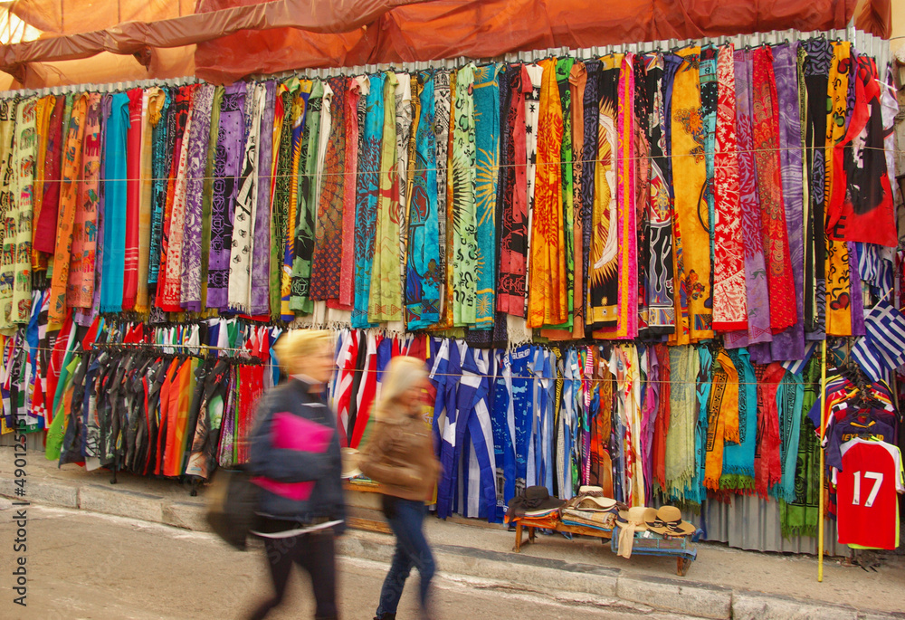 a typical market - bazaar in Greece or Turkey with scarves, carpets, colorful local costumes