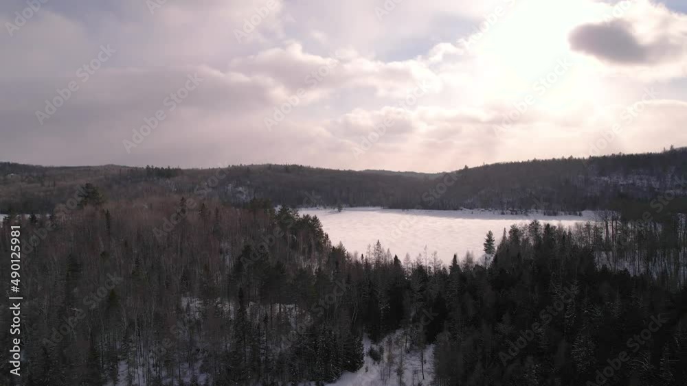 First Person View Of Aerial Flying During Winter Over Frozen Lake Landscape In Northern Ontario Canada