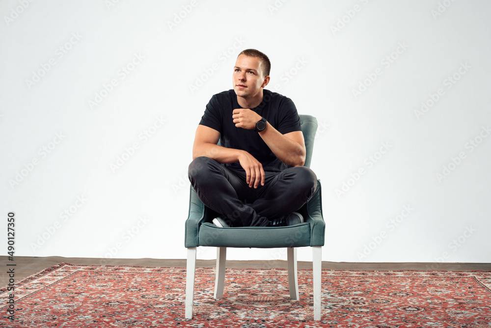an interested Man is sitting in the chair and thinking ,trying to solve problems an interested Man is sitting in the chair and thinking ,trying to solve problems
