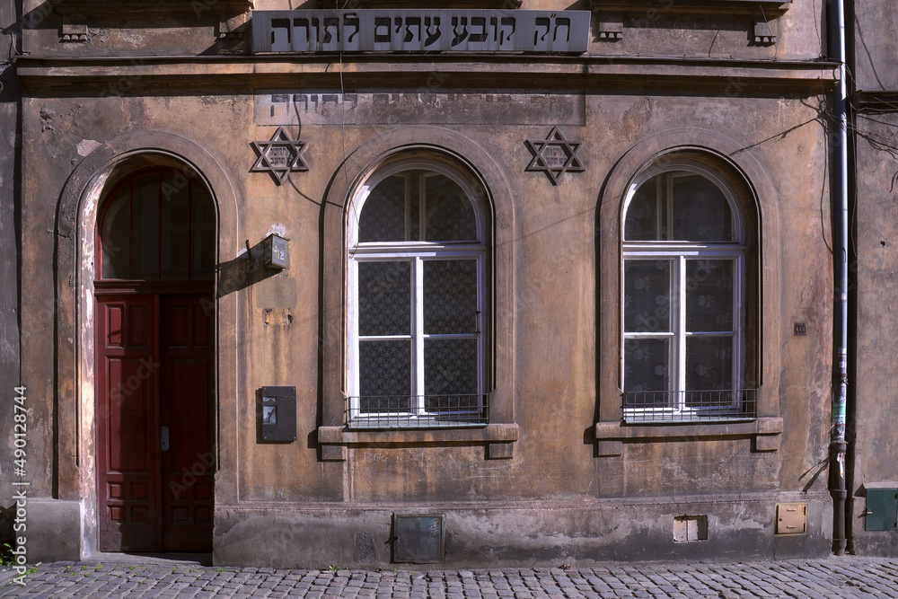 Destroyed tenement house in Poland, Kazimierz district in Krakow, Star of David, inscriptions in Yiddish ...