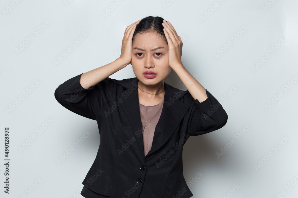 portrait of stressed sick business woman with headache on white background
