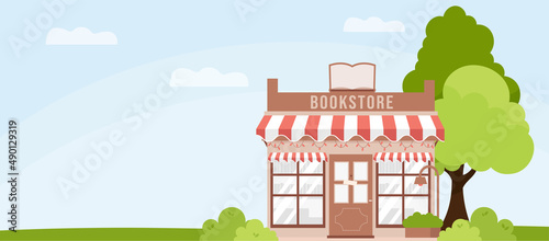 Cute cartoon Book store facade.  Sunny day, blue sky, green tree and shrubs. Flat style vector illustration. Building exterior..