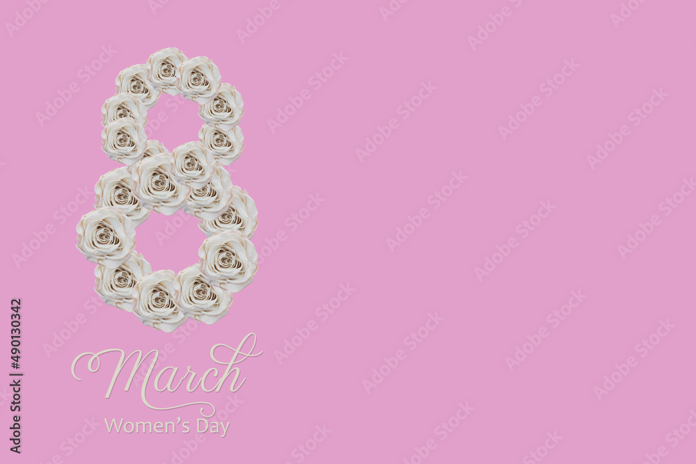 8 march lettering made of white roses one side of pink background. space for text. women's day concept 8 march lettering made of white roses one side of pink background. space for text. women's day concept