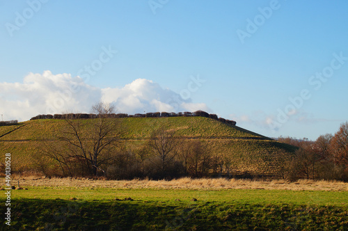 The Frankfurt-Heddernheim landfill in winter against a blue sky. photo