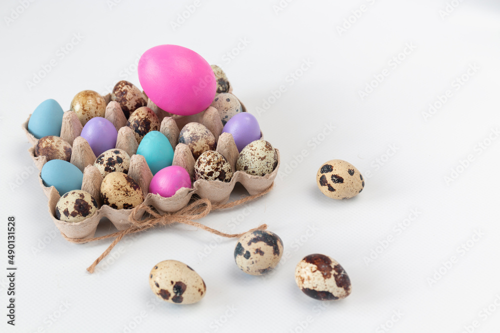 A closeup shot of Easter eggs in an eco-friendly packing against a light background