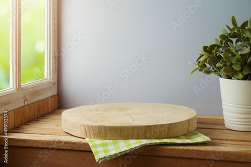 Photography Empty wooden log board  on wooden table over window background
