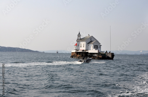 Heggholmen Lighthouse on tiny island in Oslo, Norway photo