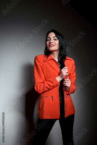 Brunette girl wear orange jacket © Tadeusz Ibrom