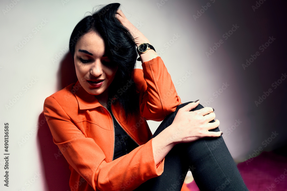Naklejka premium Brunette girl wear orange jacket