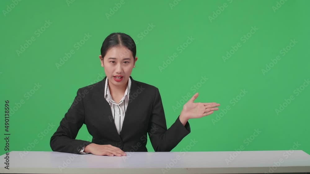 Live News Studio With Professional Asian Female Anchor Pointing On Something While Reporting On The Events Of The Day On The Green Screen
Live News Studio With Professional Asian Female Anchor Pointing On Something While Reporting On The Events Of The Day On The Green Screen