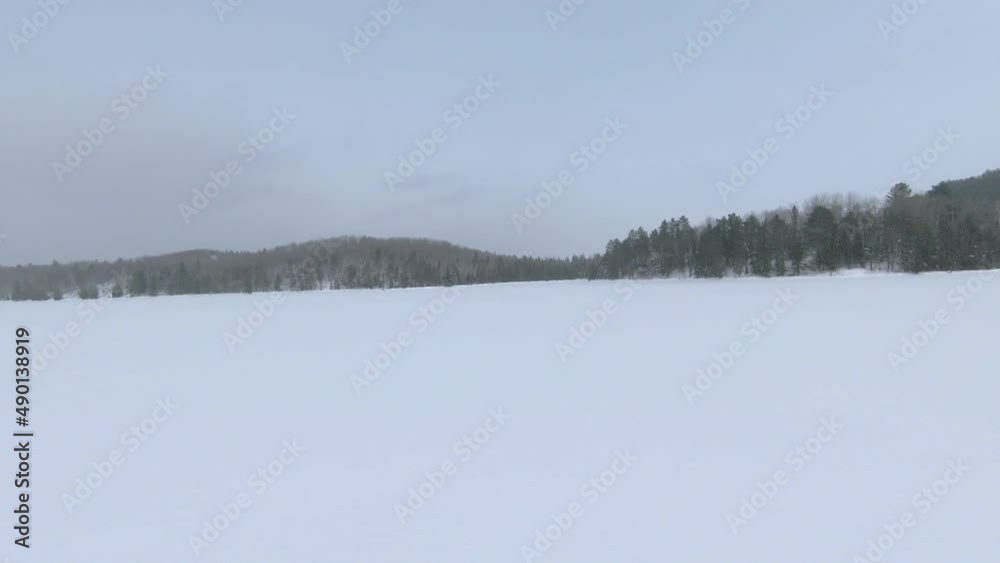 First Person View Of Aerial Low Level Flying During Winter Over Frozen Lake Landscape In Northern Ontario Canada First Person View Of Aerial Low Level Flying During Winter Over Frozen Lake Landscape In Northern Ontario Canada