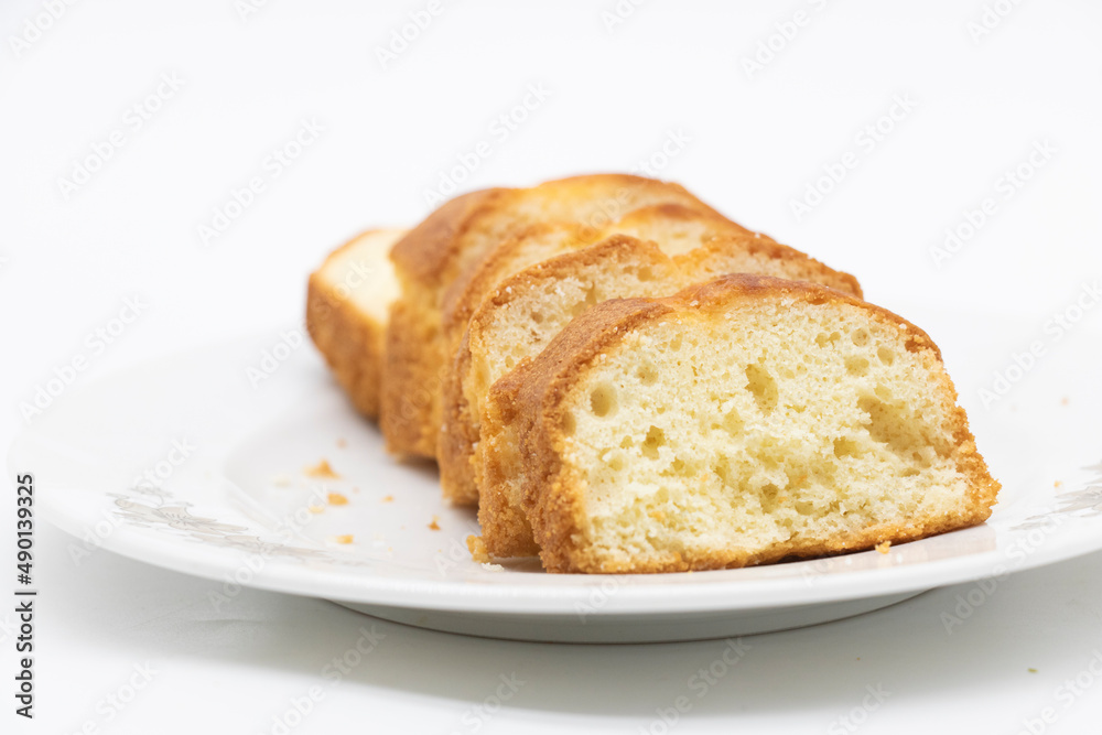 some slices of pound cake over on white background
