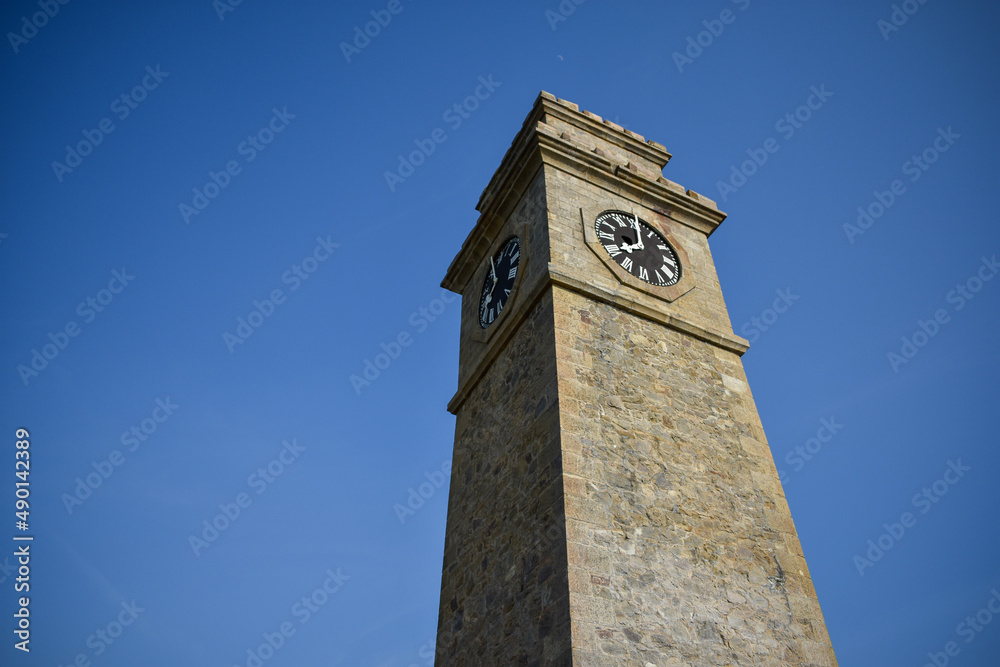 Low angle of a clock tower under the blue sky in Sri Lanka Stock Photo ...