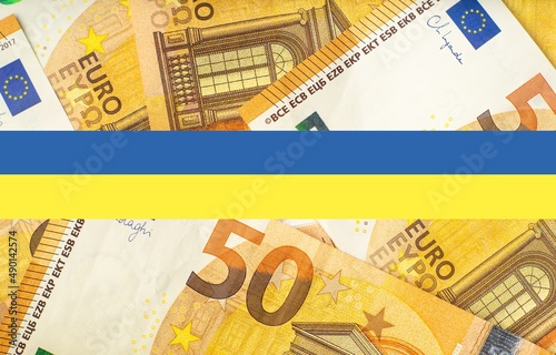 Obraz na płótnie Ukrainian flag banner on euro money background. Financial and economical background for Ukraine war support by Europe topics. 3D rendering illustration. w salonie